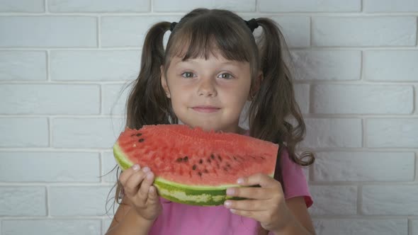 Child eat a watermelon. 