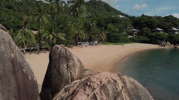 Beach Resort on Koh Tao with Beautiful Rocks and White Sand Beach and Palm Trees
