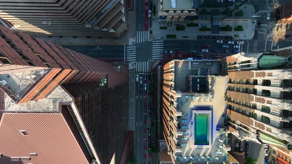 Top down aerial of empty city street in metropolitan downtown city. Descending aerial during pandemi