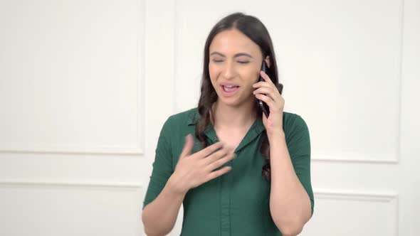 Happy Indian woman talking on a call