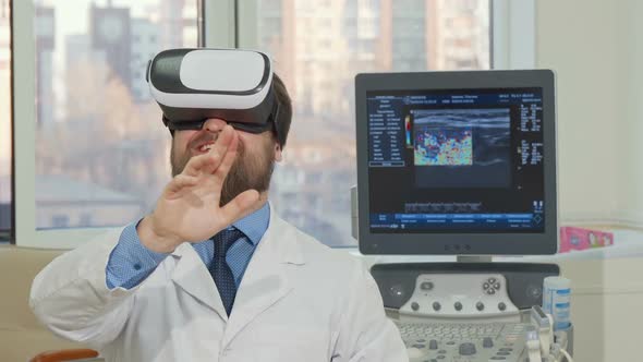 Bearded Male Doctor Using 3d Vr Glasses at the Hospital