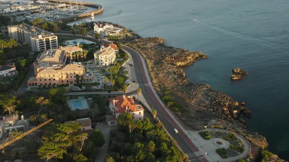 Car Driving on Road at Atlantic Ocean of Cascais City Portugal Europe alt