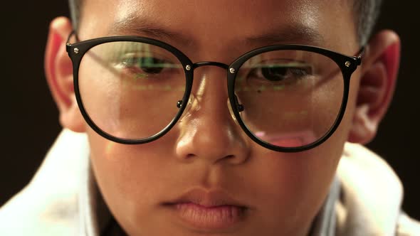 Face Of Asian Boy Hacking Computer System alt