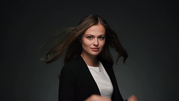 Portrait of Young Beautiful Caucasian Woman Turning and Looking at Camera