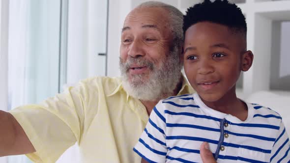 Mature man enjoying time with his grandson