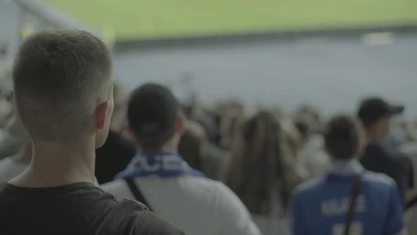 Fans at the Stadium During the Match. Slow Motion.