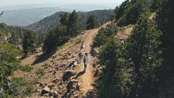 Female Woman Tourist Traveler Walk Rocky Highland Hill Area Hiking in Wild Scenic Cyprus