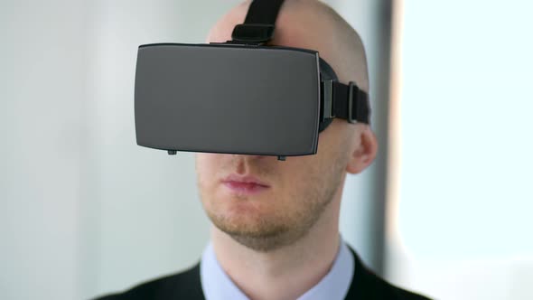 Businessman with Virtual Reality Headset at Office 17