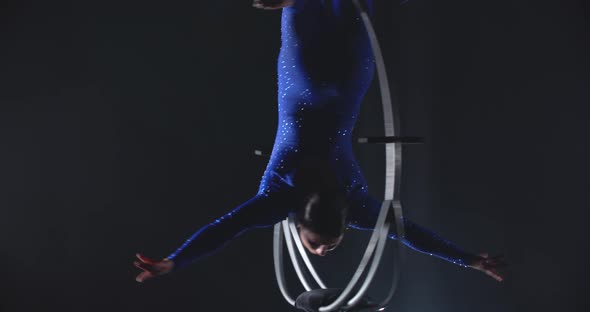 Gymnastics Performance in the Studio Woman is Doing a Handstand Split