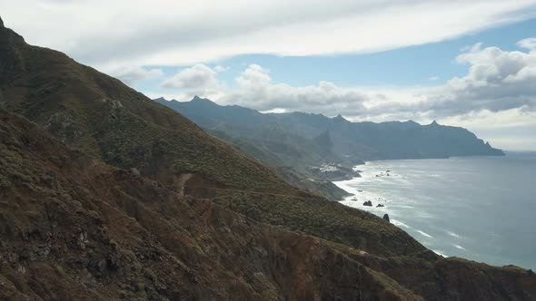 Awesome Beautiful AERIAL View of Small Village in Mountains Over the Atlantic Ocean on Tenerife