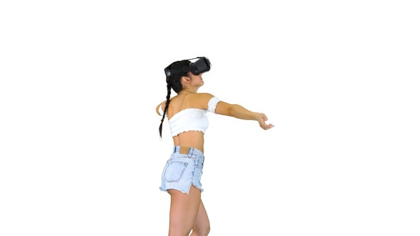 Woman using VR Virtual Reality headset walking and dancing