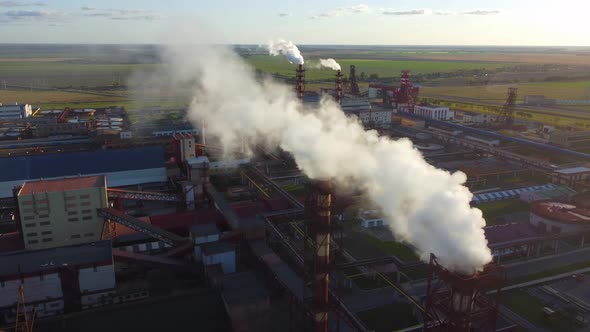 White smoke from the chimney of an industrial enterprise.
