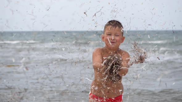 Beach Summer Vacation. Children's Emotions. The Child Develops Tinsel in the Wind