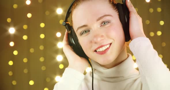 Girl Enjoying Listening to Music in Headphones
