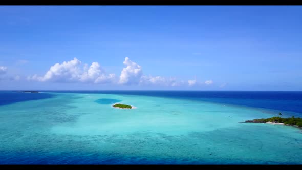 Aerial above seascape of tropical coastline beach voyage by turquoise water with white sandy backgro