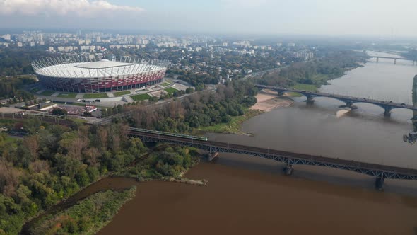 Slide and Pan Footage of Modern National Stadium on Vistula Riverbank