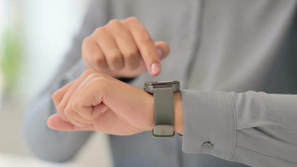 Close Up of African Woman Using Smart Watch