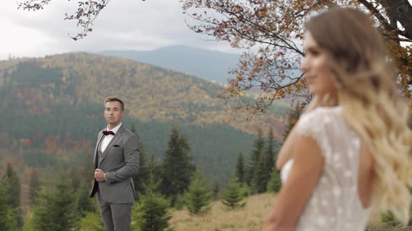 Lovely Caucasian Wedding Couple Newlyweds Family Bride Groom Stay Together on Mountain Slope Hill