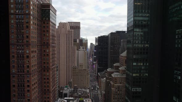 Aerial view over the 7th Avenue, in Manhattan, New York city, USA - reverse, drone shot