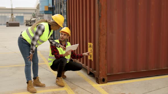 Industrial Multiracial Operators Working at Container Freight Cargo Logistics Terminal