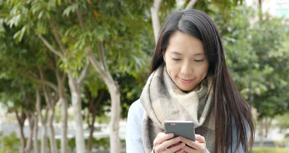 Woman use of mobile phone in the city