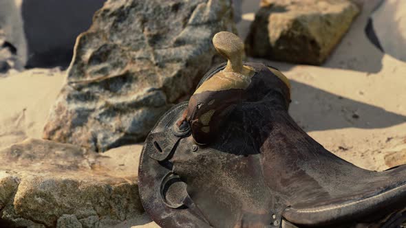 Very Old Horse Saddle on Sand Beach