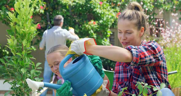 Mother and Daughter Gardening Together