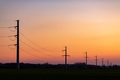 High voltage power tower over sunset clear sky, blackout concept - PhotoDune Item for Sale