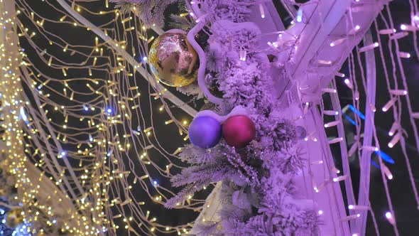 Christmas Balls Close-up. Toys Hanging on the Tree. The City Is Decorated for the Holiday. Colored