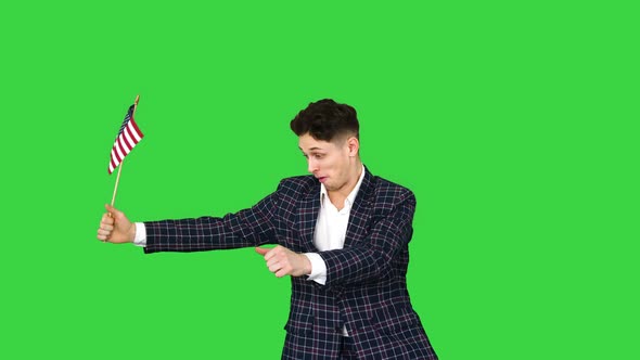 Young Man in Formal Suit Dancing in a Funny Way with American Flag on a Green Screen, Chroma Key