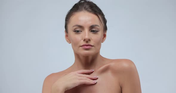 Portrait of Young Woman with Smooth Healthy Skin She Gently Touches Her Shoulders with Her Fingers