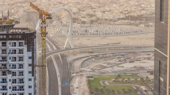 Skyscrapers and Road with Bridge Before Sunset Timelapse of Doha Qatar