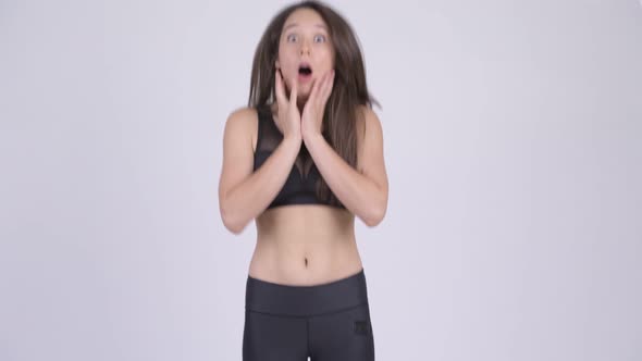 Young Beautiful Multi-ethnic Woman Looking Shocked Ready for Gym