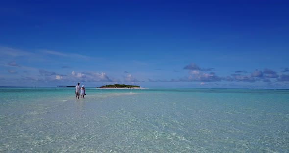 Happy couple after marriage in love enjoy life on beach on white sand 4K background