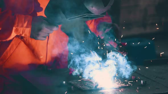 Metal Welder Working with Arc Welding Machine