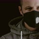 White male wearing protective facial mask during corona virus, 4k slow motion black background - VideoHive Item for Sale