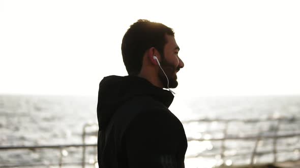 Young Attractive Male with Beardand Caucasian Appearance Smilingand Looking at the Camera While