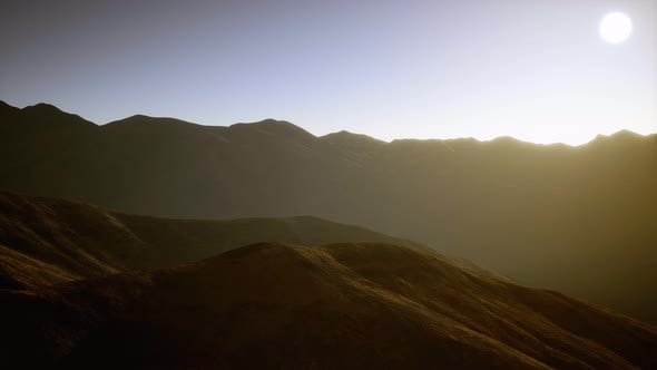 Hills with Rocks at Sunset