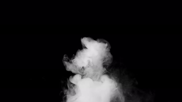 Soft fog in slow motion on dark background