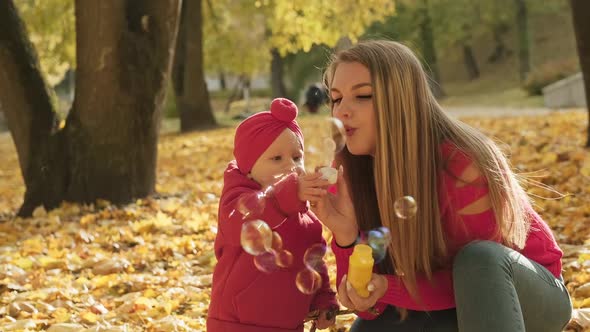 Family Playing with Bubbles Outdoors