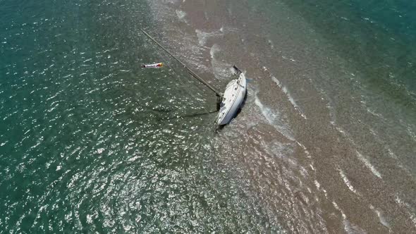 Aerial view of boat aground at sandbank in Gulf of Patras, Greece.