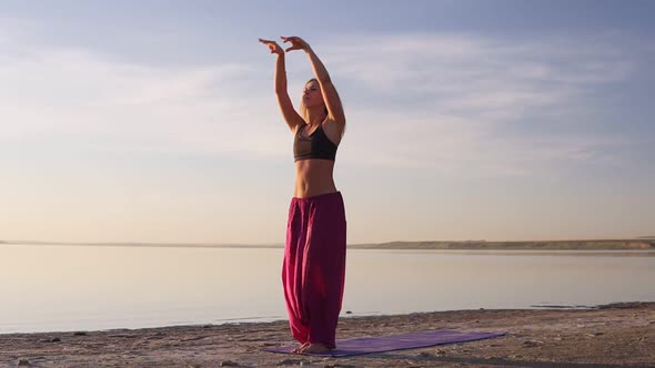 Flexible Healthy Young Girl Practice Yoga Beach