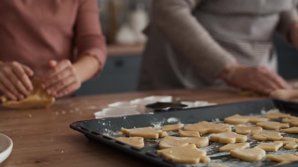 Caucasian girl baking homemade cookies with grandmother. Shot with RED helium camera in 8K