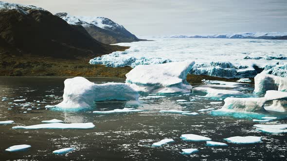 Antarctic Icebergs Near Rocky Beach