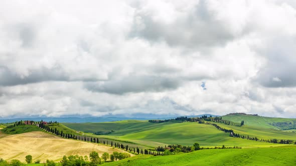 Time Lapse of the clouds over the rolling hills of Tuscany Italy