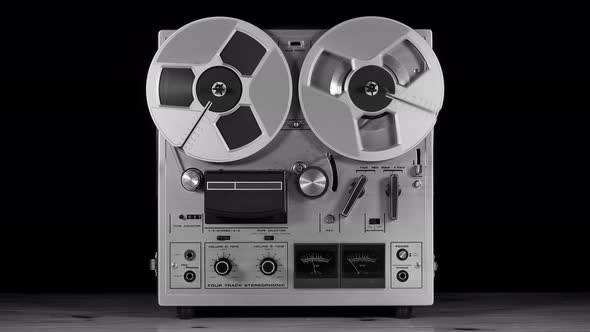 Vintage Reel to Reel tape recorder playing music