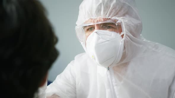 PCR Test Process Doctor Wearing Protective Equipment Taking Sample From Nose of Patient for Antigen