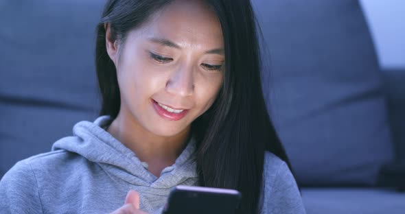 Woman using mobile phone for online shopping