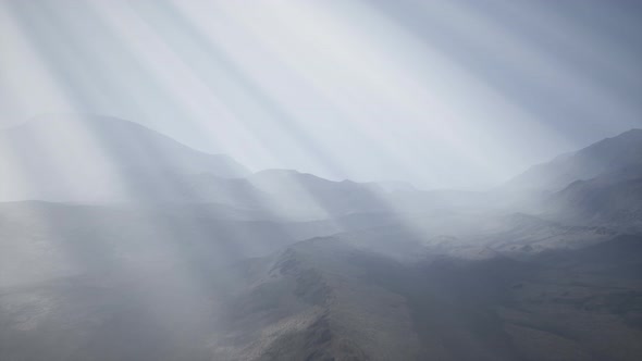 Sun Rays Against the Backdrop of the Mountains