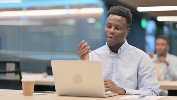 African Businessman Talking on Video Call on Laptop